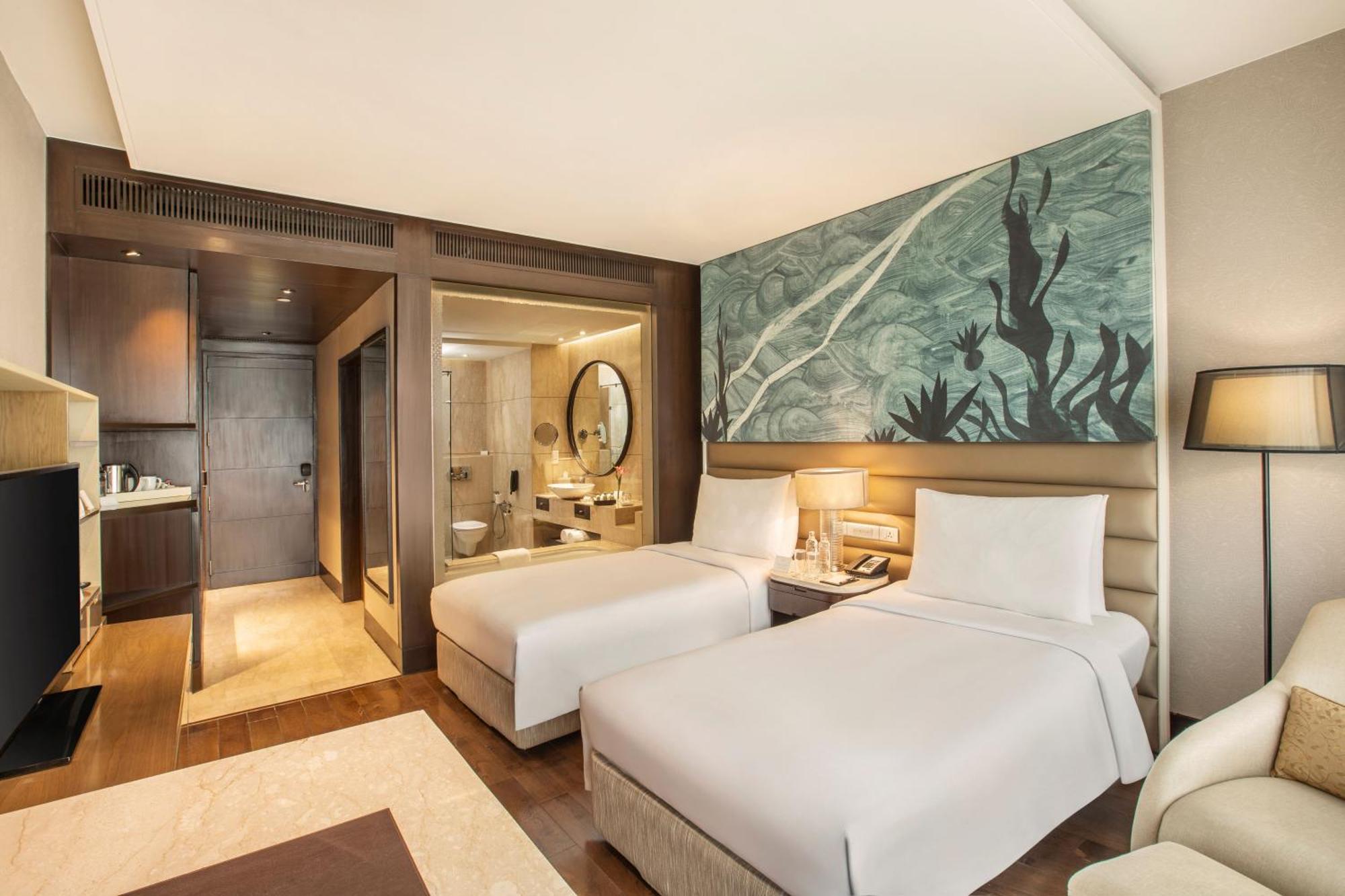 เดอะ ลีลา เดลี แอมเบียนซ์ คอนเวนชั่น โฮเต็ล Hotel นิวเดลี ภายนอก รูปภาพ Deluxe Room